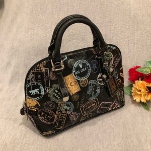 NWOT - Black & Silver Chrome Bag with Multicolored Travel Stamp Motif